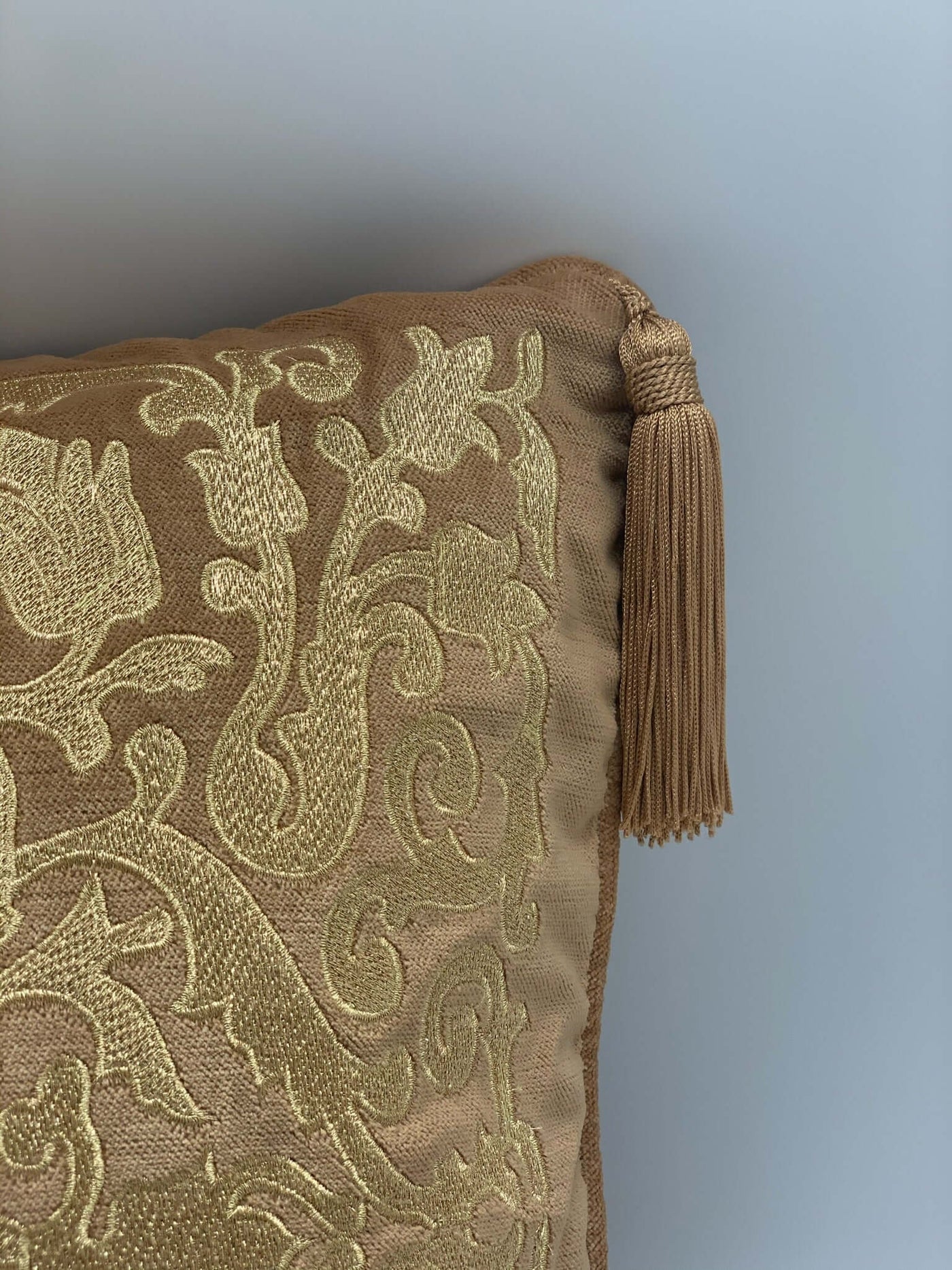 Golden embroidered tasseled cushion set of 2